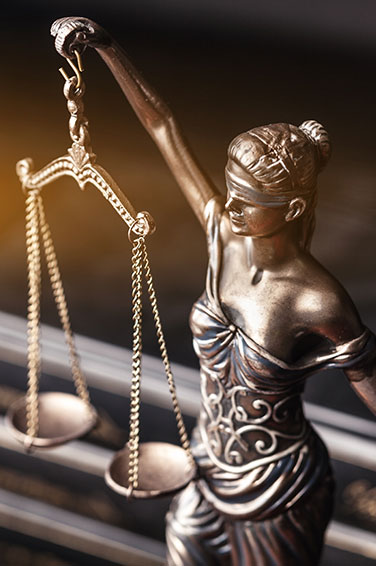 Statue of Lady Justice holding scales