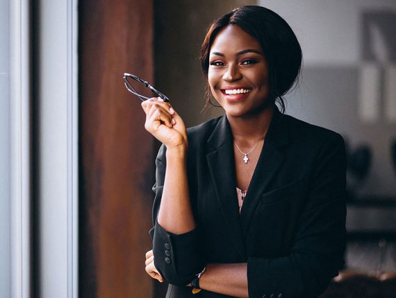 An advocate smiling in her office